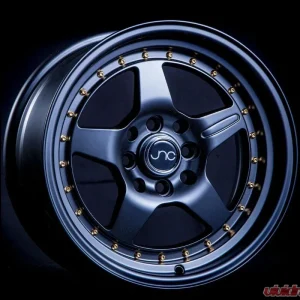 JNC JNC009 Wheel 15x8 4x100|4x114.3 25mm Matte Black w/ Gold Rivets - Image 1