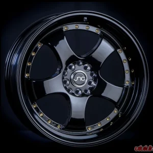 JNC JNC017 Wheel 17x9 5x100|5x114.3 20mm Gloss Black w/ Gold Rivets - Image 1