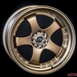 JNC JNC017 Wheel 17x9 5x100|5x114.3 20mm Matte Bronze w/ Gold Rivets - Image 1